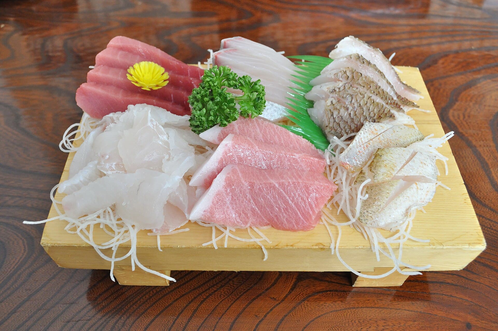 Aged Sashimi Board. Otoro, madai, hirame, shaved daikon, served on hinoki.